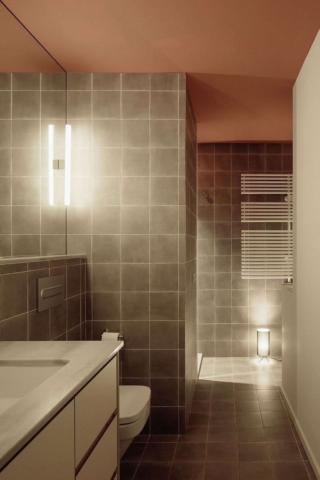 A modern bathroom with clean lines, warm tones, and minimalist fixtures.
