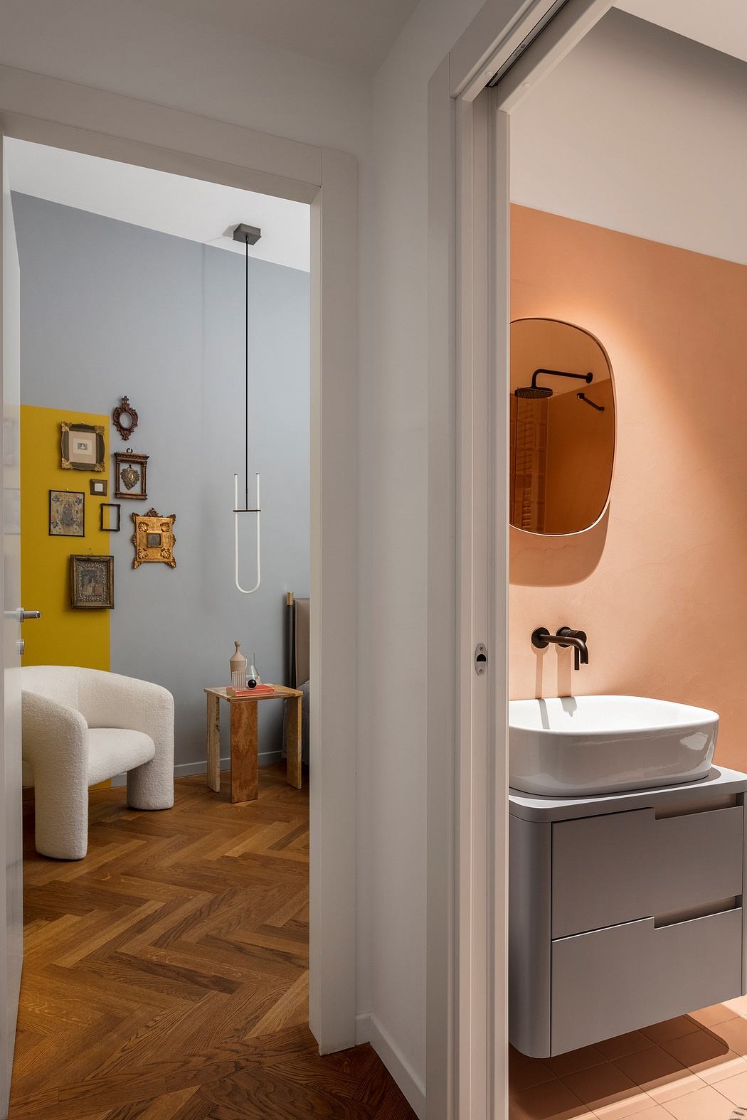 A stylish bathroom with a vessel sink, wooden vanity, and warm-toned lighting.