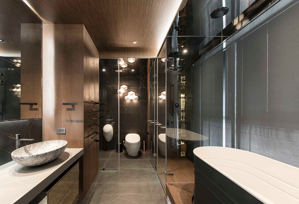 Luxurious bathroom with sleek fixtures, contemporary lighting, and a spacious layout.