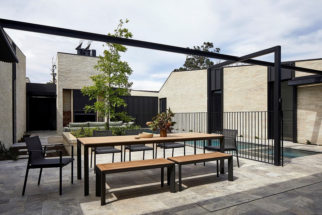 Sleek modern architecture with wood, steel, and natural elements in outdoor living space.