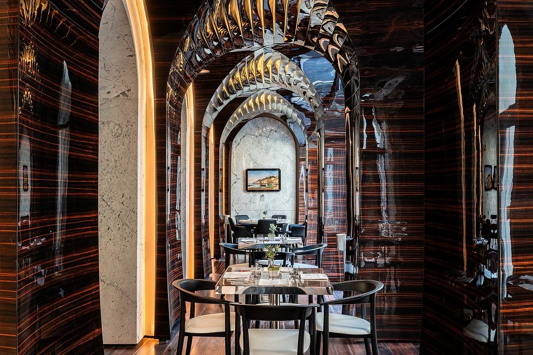 Ornate wooden archways, marble floors, and modern furnishings in an elegant interior.