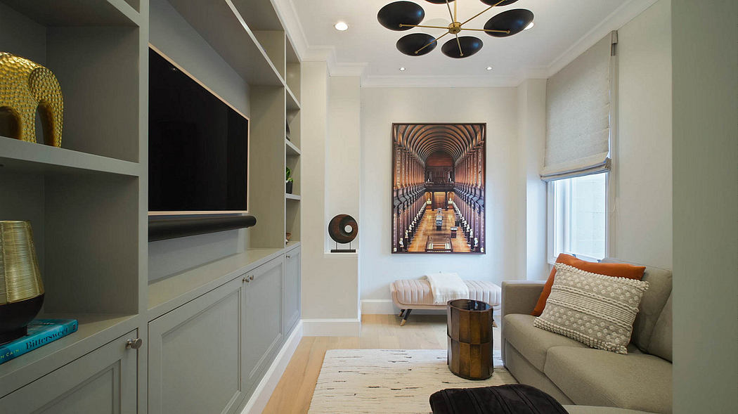 Elegant modern interior with sleek furniture, unique lighting, and a striking architectural print.