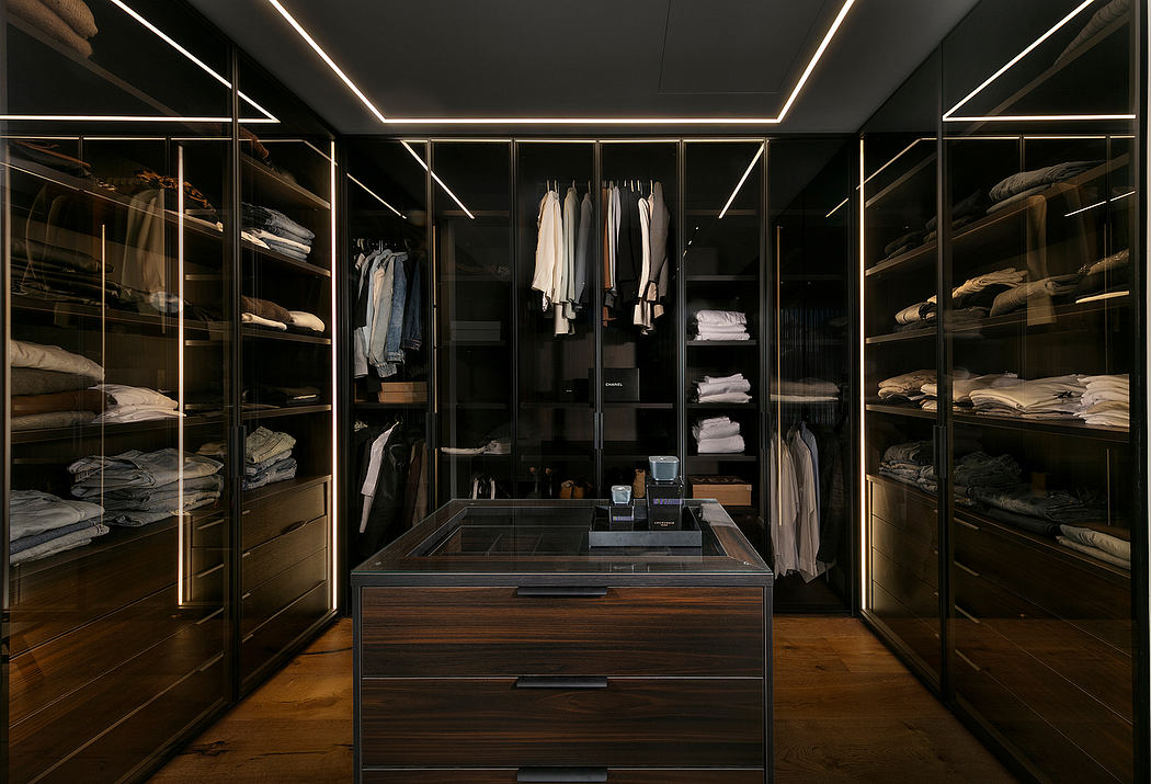 Sleek, minimalist walk-in closet with modern shelving, lighting, and storage compartments.