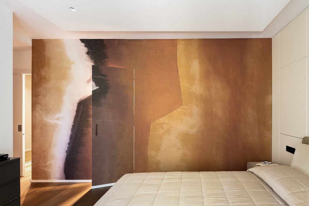 Spacious bedroom with abstract, earthy-toned wall mural and minimalist furniture.