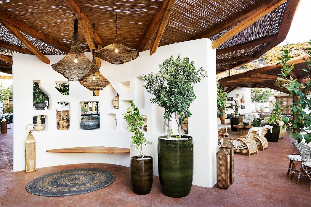 Rustic Mediterranean-style interior with woven ceiling, potted plants, and decorative accents.