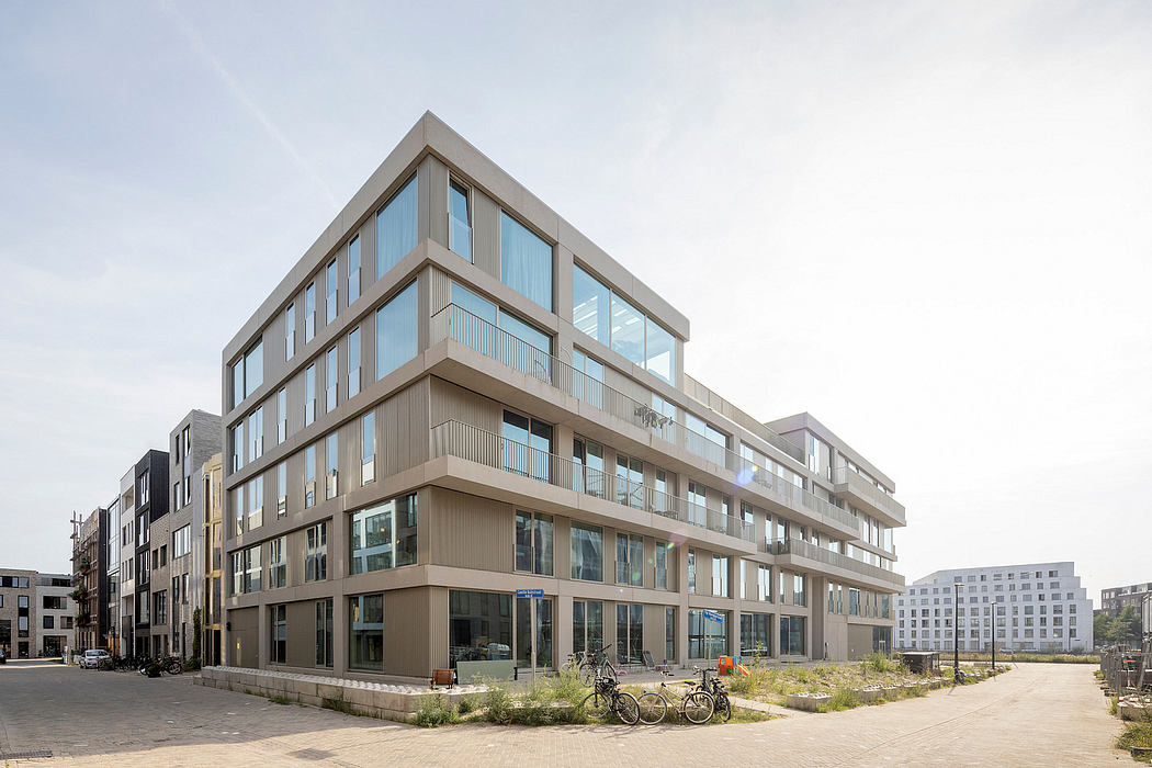 Modern multi-story building with sleek, angular design and large windows.