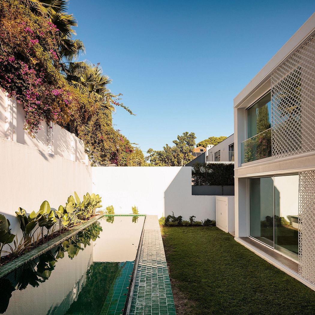 Modern architectural design with lush landscaping, reflecting pool, and spacious layout.