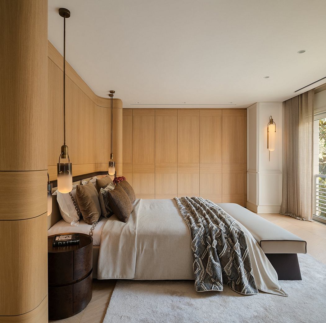 Modern, wood-paneled bedroom with pendant lights, plush bedding, and a cozy ambiance.