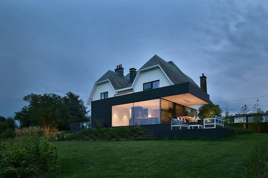 A modern extension with a striking black facade blends seamlessly with the traditional home.