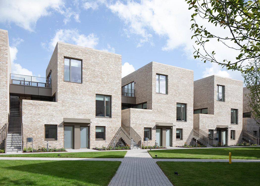 Modern brick apartment buildings with clean lines, balconies, and landscaped grounds.