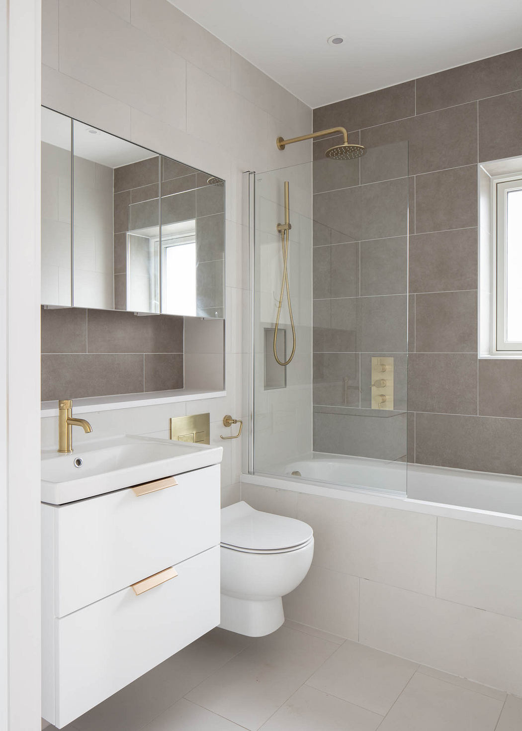 Visually striking bathroom with sleek gray tiles, modern fixtures, and clean lines.