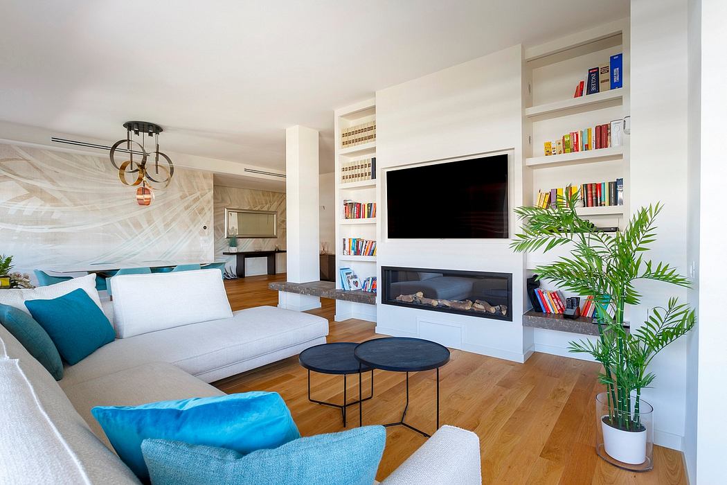 Modern living room with sleek fireplace, built-in shelves, and tropical plant accents.