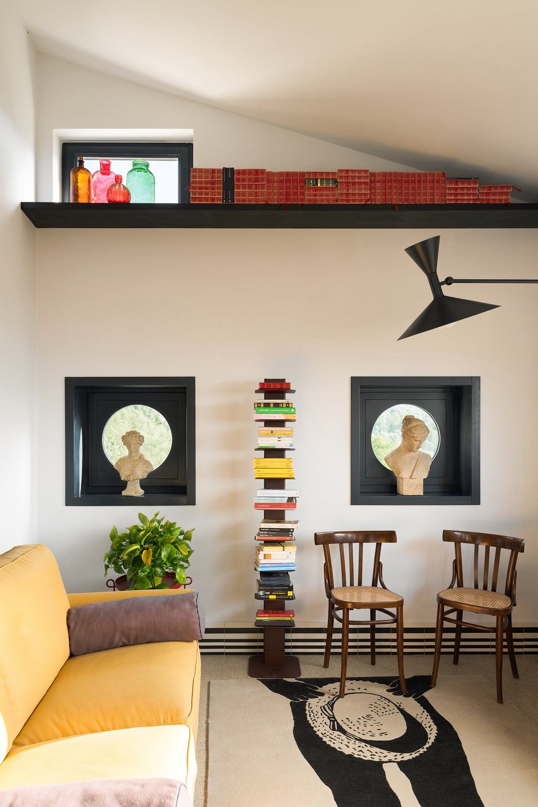 Cozy interior with decorative wall shelves, framed art pieces, and retro-style furniture.
