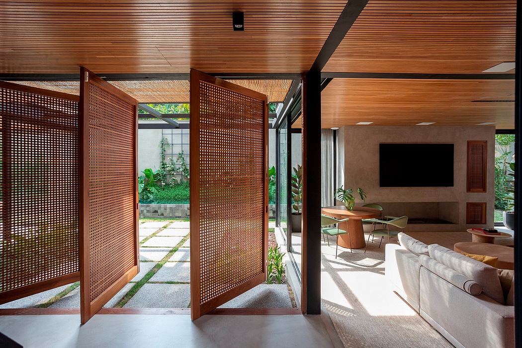 Warm, wooden screens frame interior and outdoor spaces, creating an inviting ambiance.