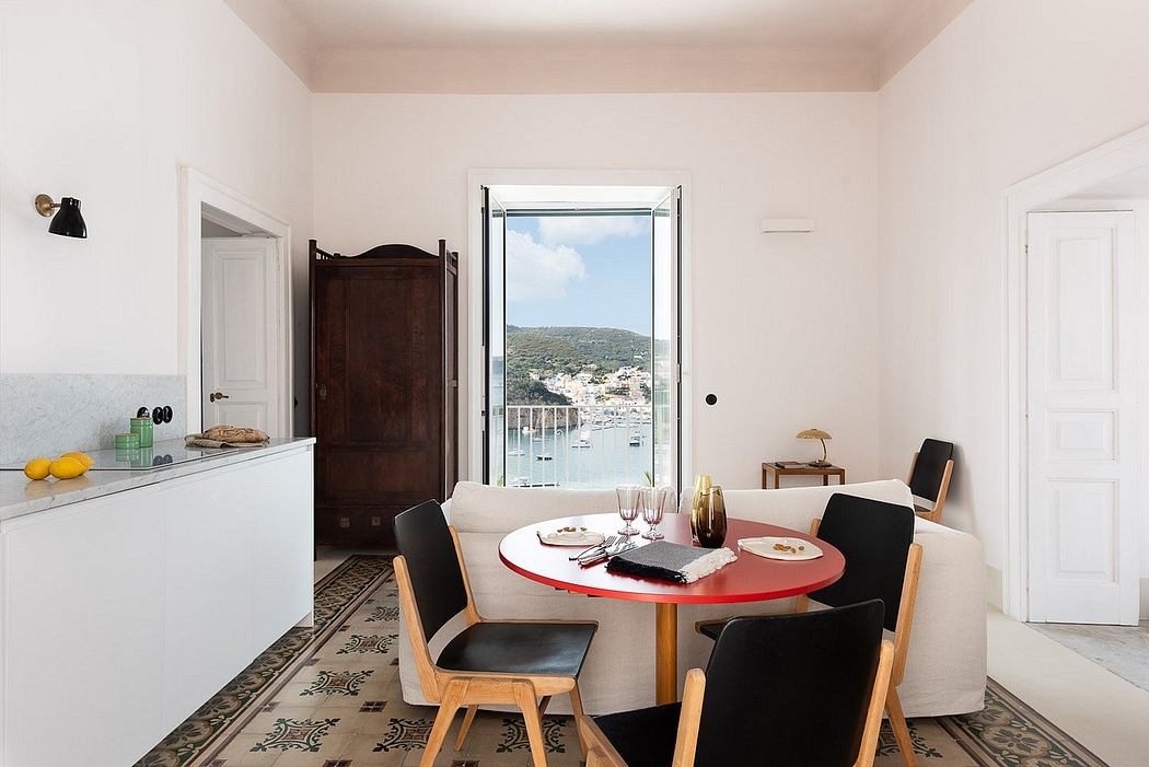 Bright, modern apartment with white walls, wooden furniture, and a scenic balcony view.