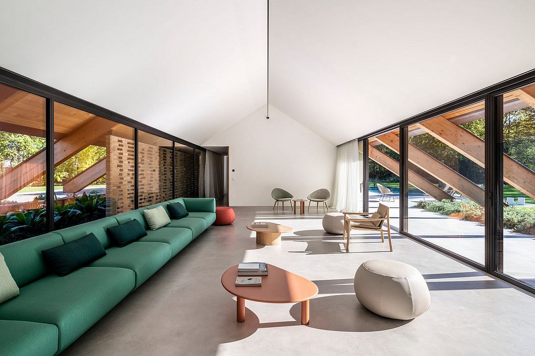 Expansive living space with wooden beams, large windows, and modern furnishings.