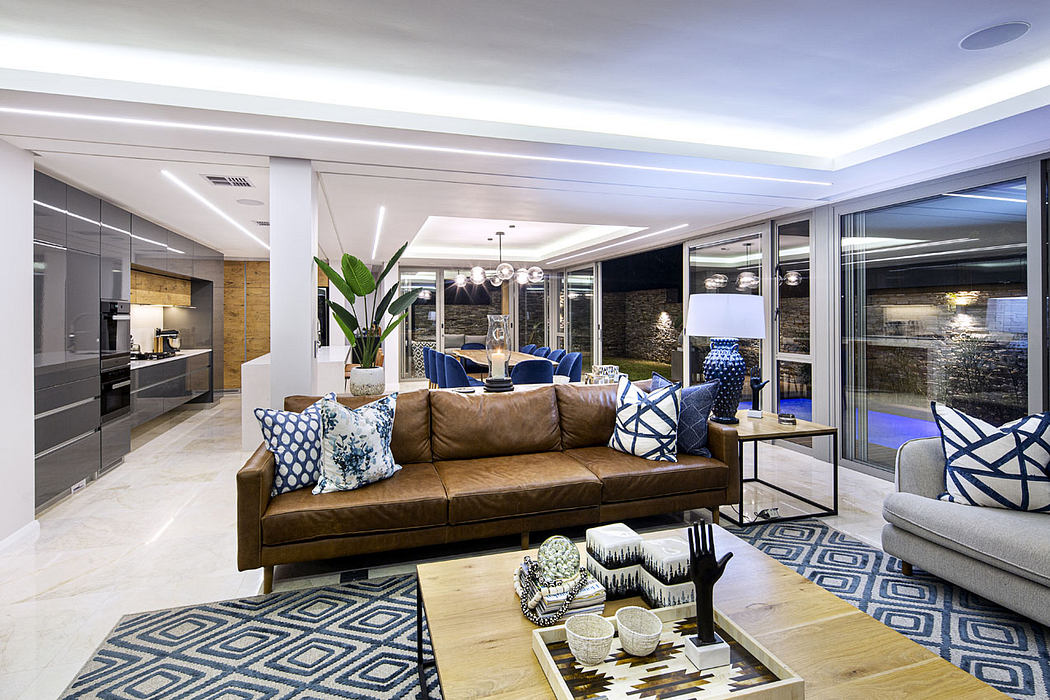 Luxurious open-concept living space with sleek modern furniture, lighting, and accents.