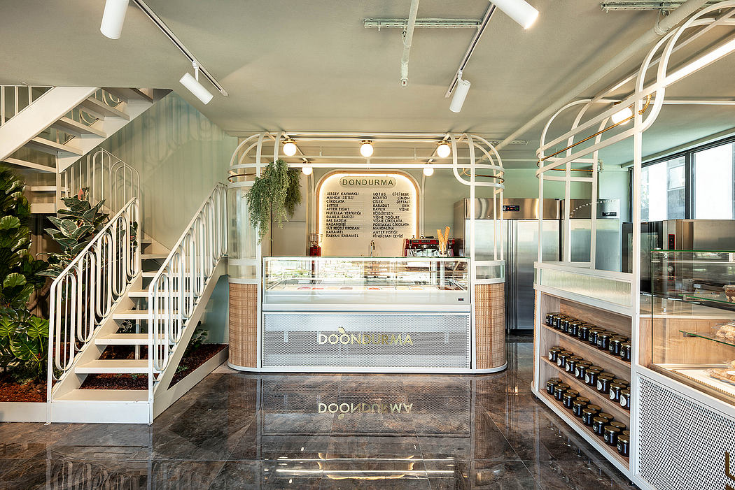 Elegant, modern cafe interior with sleek counter, hanging plants, and intricate architectural details.