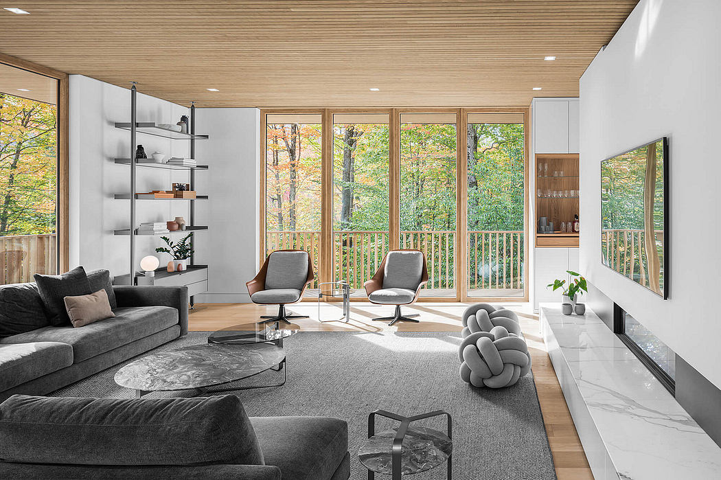 Modern living room with floor-to-ceiling windows, wood-paneled ceiling, and sleek furniture.