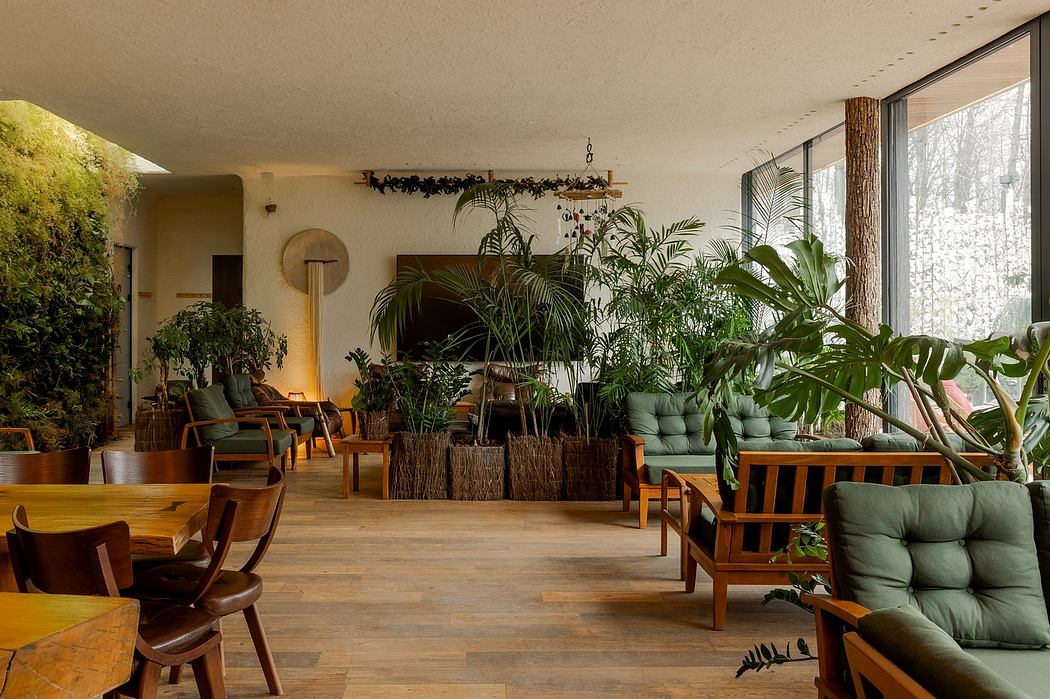 Cozy, plant-filled indoor lounge area with wooden furniture and natural materials.