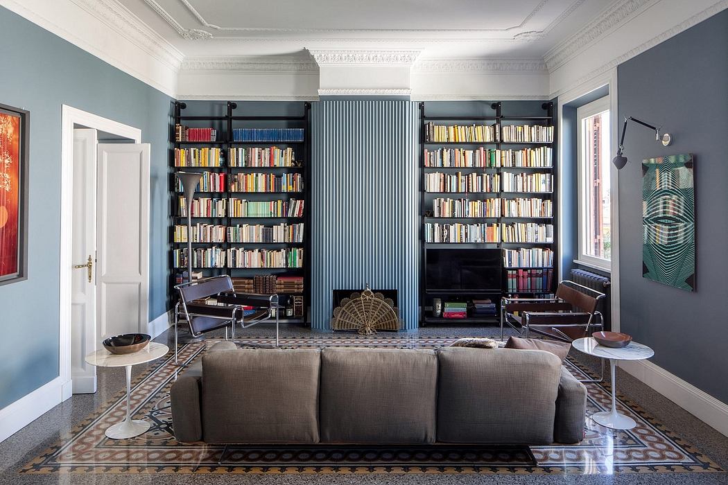 Spacious living room with ornate architectural features, built-in bookshelves, and mid-century furnishings.