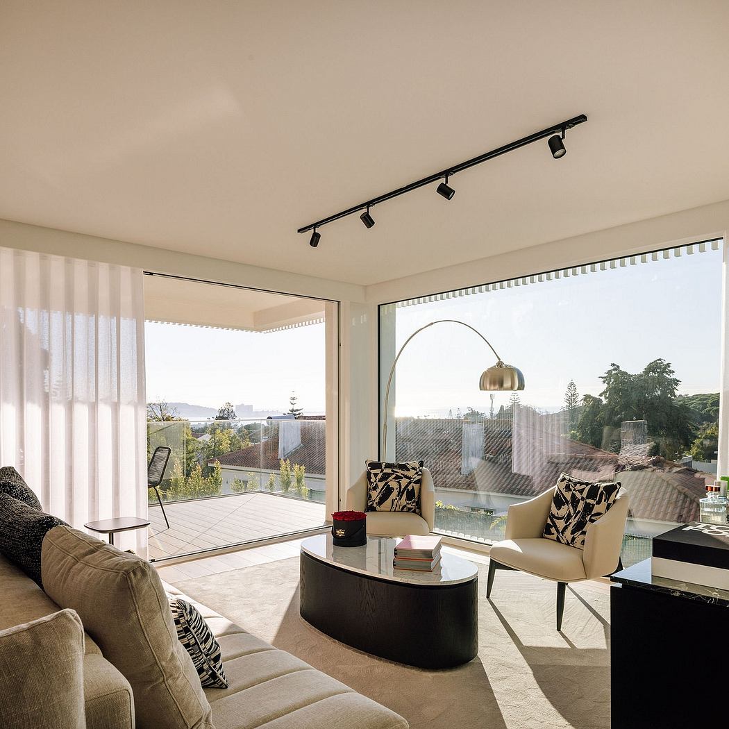 Spacious living room with floor-to-ceiling windows, modern furniture, and chic lighting.