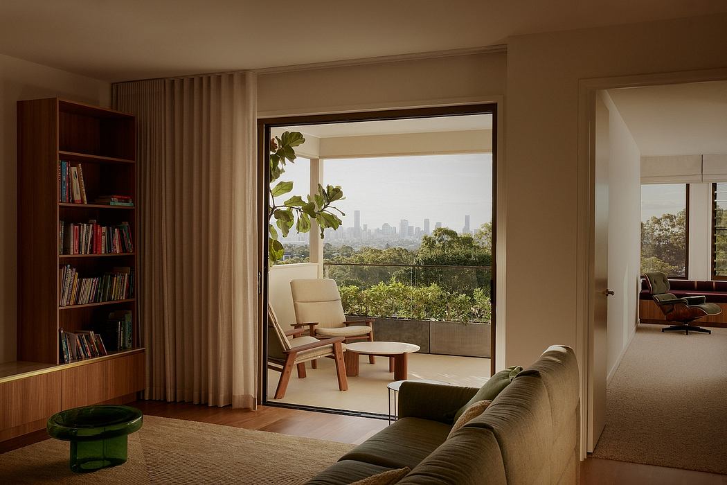 Spacious living room with large sliding glass door offering scenic cityscape view.