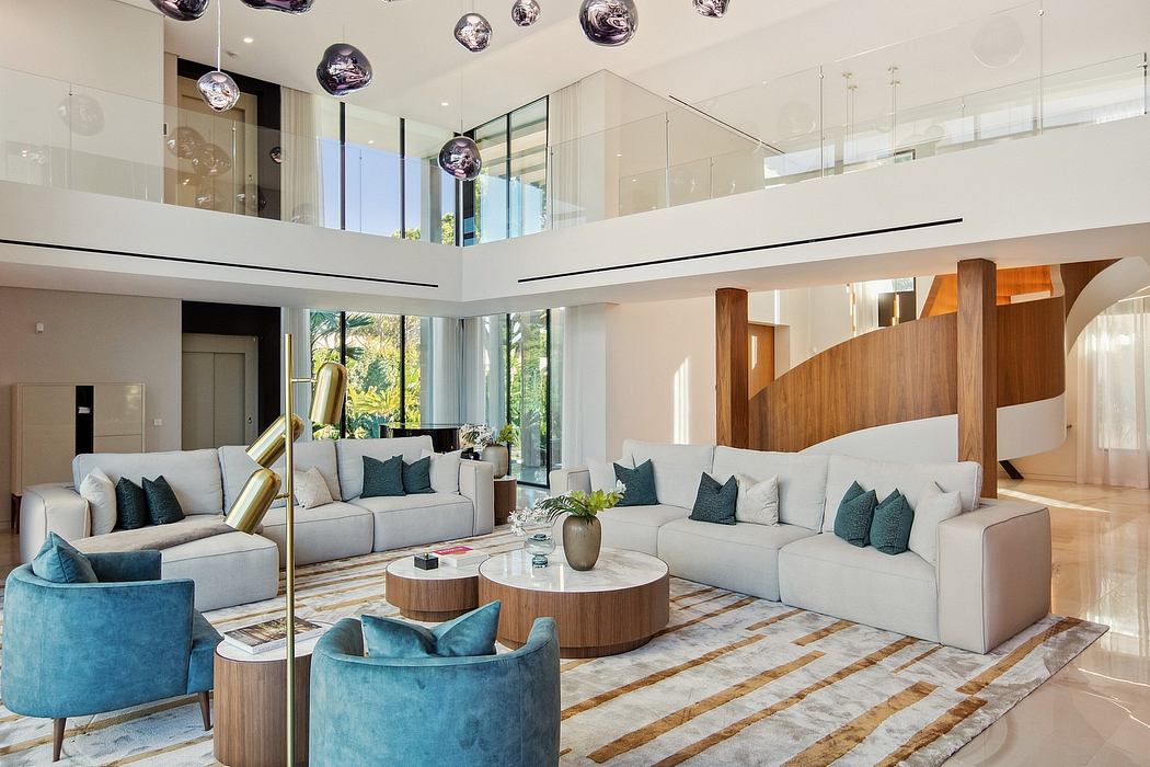 Spacious modern living room with high ceilings, wood accents, and an opulent light fixture.