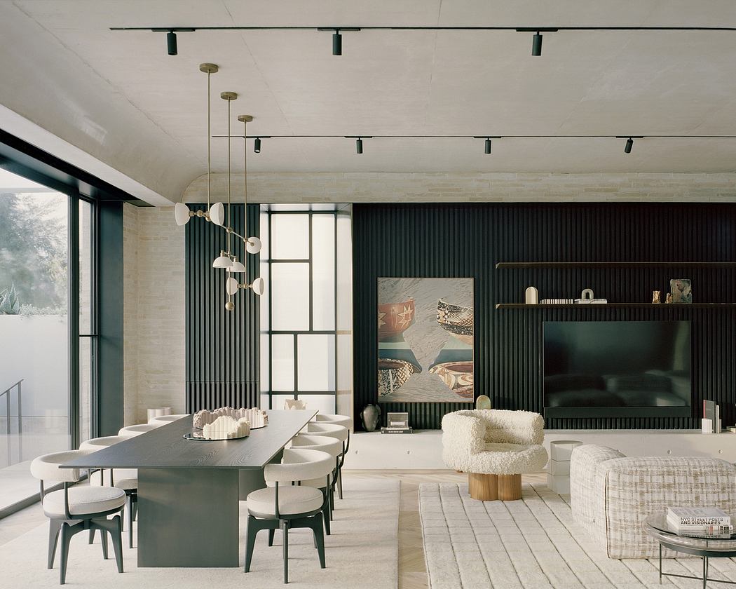 Modern open-plan living space with sleek furniture, bold black accents, and recessed lighting.