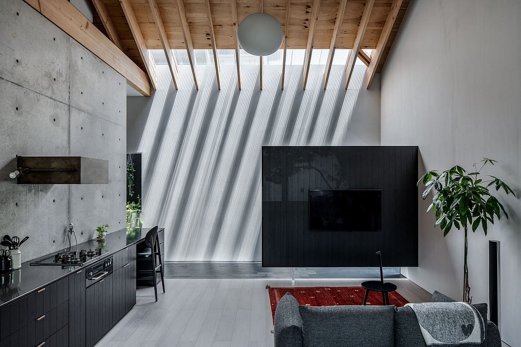 Minimalist interior with concrete walls, wooden beams, and a sleek black TV unit.