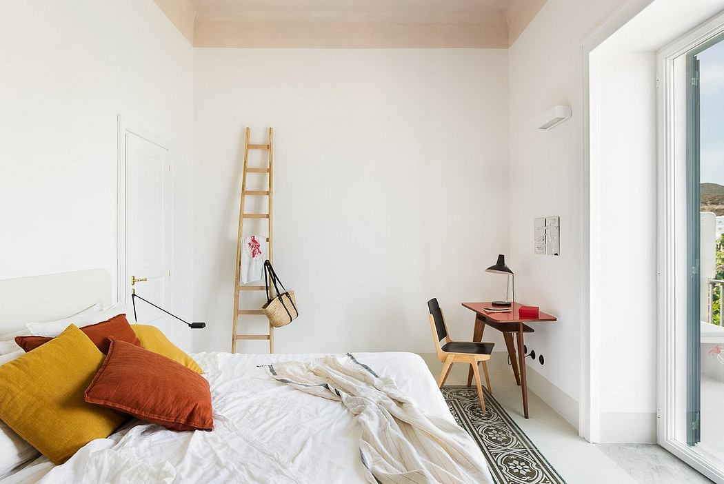 Bright, minimalist bedroom with white walls, wooden ladder, and cozy textured bedding.