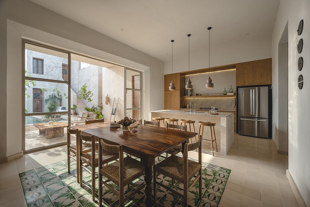 Spacious, open-concept kitchen and dining area with sleek modern design and wooden accents.