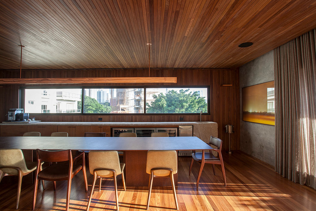 Stunning mid-century modern interior with warm wood paneling, large windows, and minimalist decor.