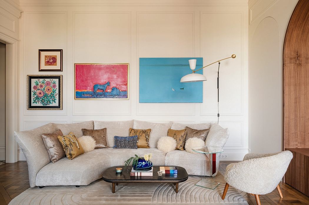 Elegant living room with plush sofa, artistic wall decor, and mid-century modern furnishings.