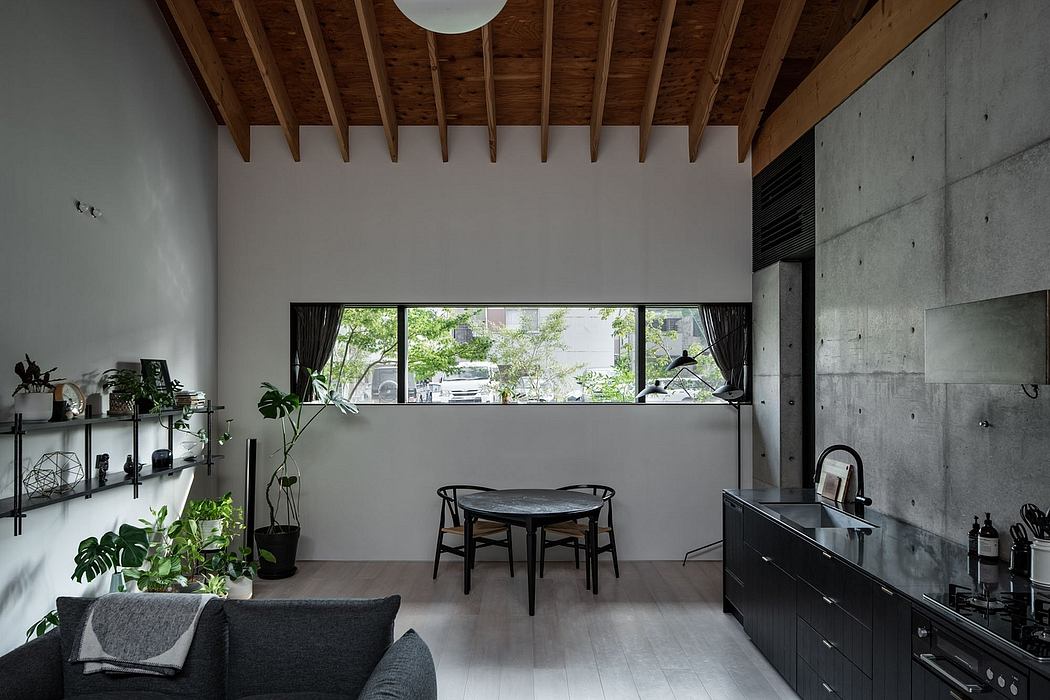 Minimalist living room with wooden ceiling beams, concrete walls, and modern furnishings.