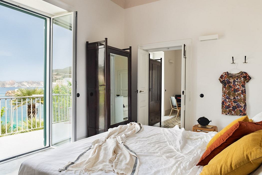 Cozy bedroom with panoramic views, rustic wooden furniture, and colorful accents.