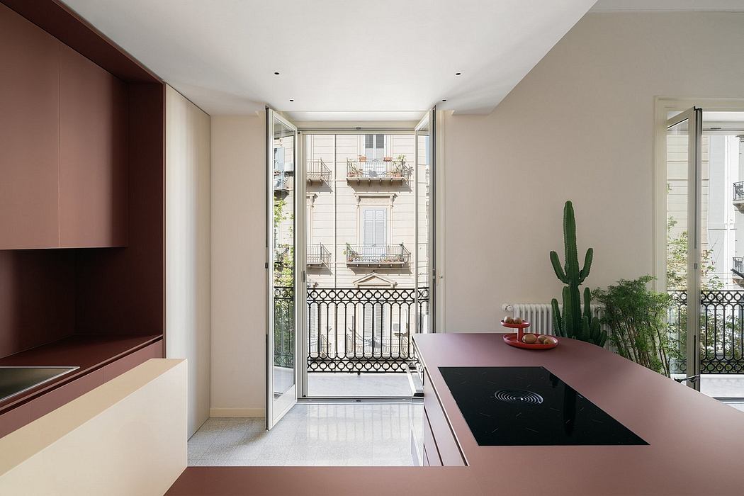 Spacious modern kitchen with balcony access, clean lines, and minimalist design.