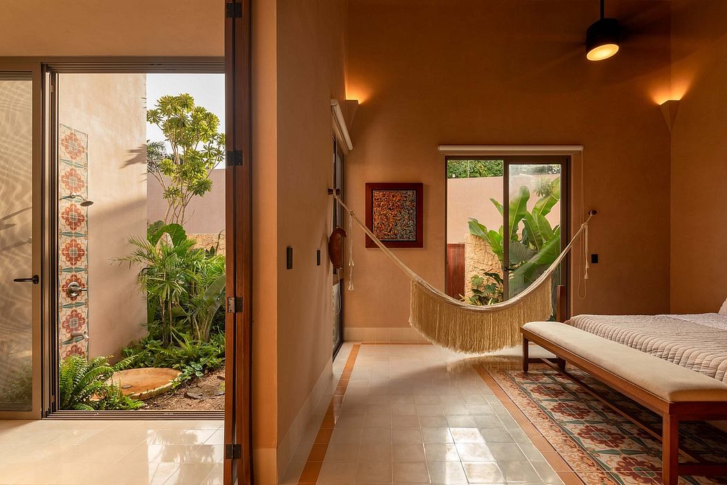Warm-toned interior with hammock, tropical plants, and patterned tile floors.