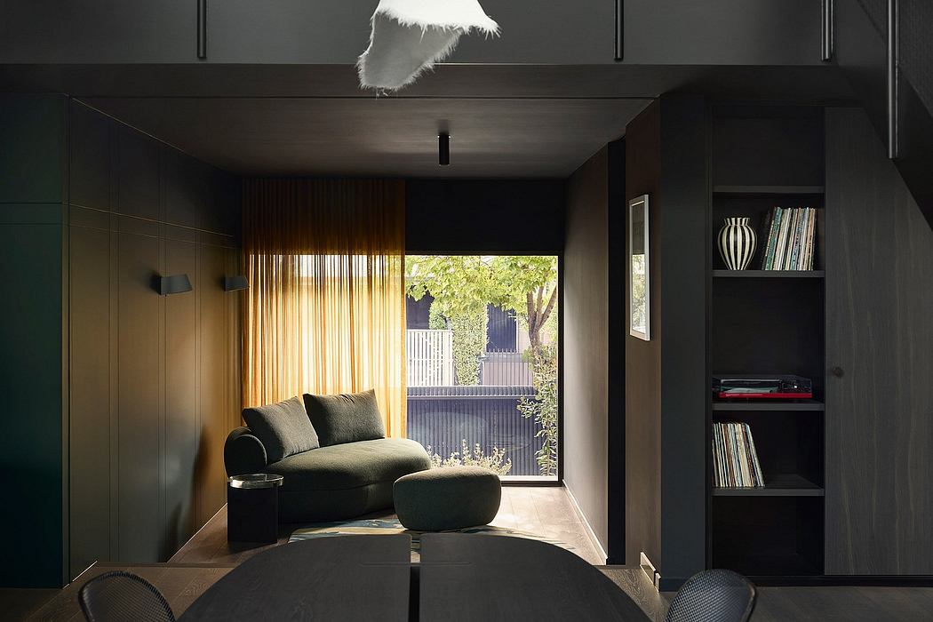 Cozy living space with plush sofa, minimalist shelving, and warm curtains framing the view.