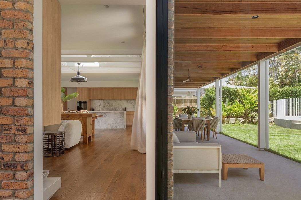 Warm, open-concept home with exposed brick, wood ceilings, and seamless indoor-outdoor flow.