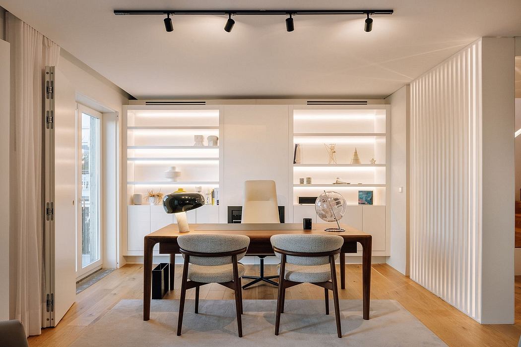 Sleek, minimalist interior design with warm wood tones, track lighting, and built-in shelving.