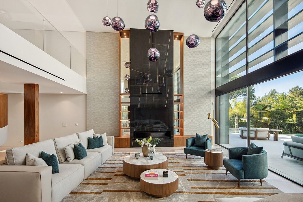 Luxurious living room with modern lighting fixtures, cozy seating, and a grand fireplace.