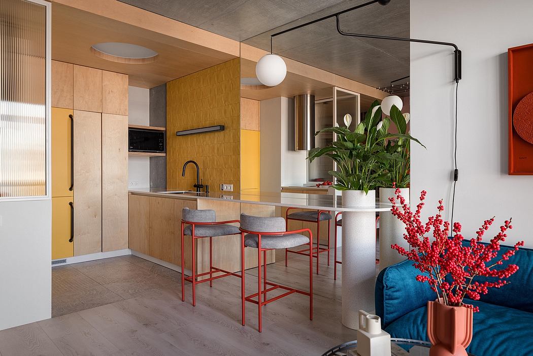 Contemporary kitchen with wood cabinetry, red accents, and a plant-filled display.