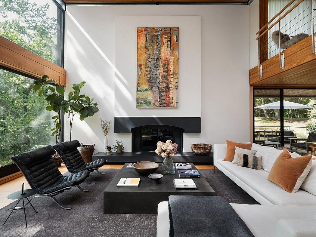 Bright, modern living space with minimalist furniture, abstract artwork, and large windows.