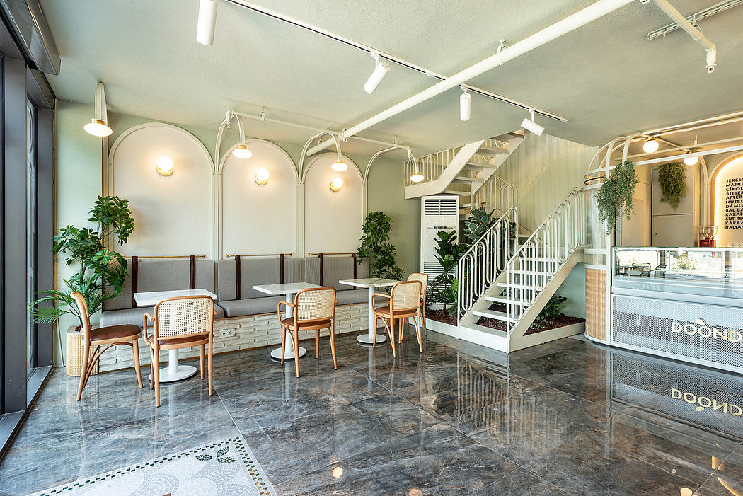 Bright, modern cafe interior with arched windows, wood furnishings, and reflective tile floor.