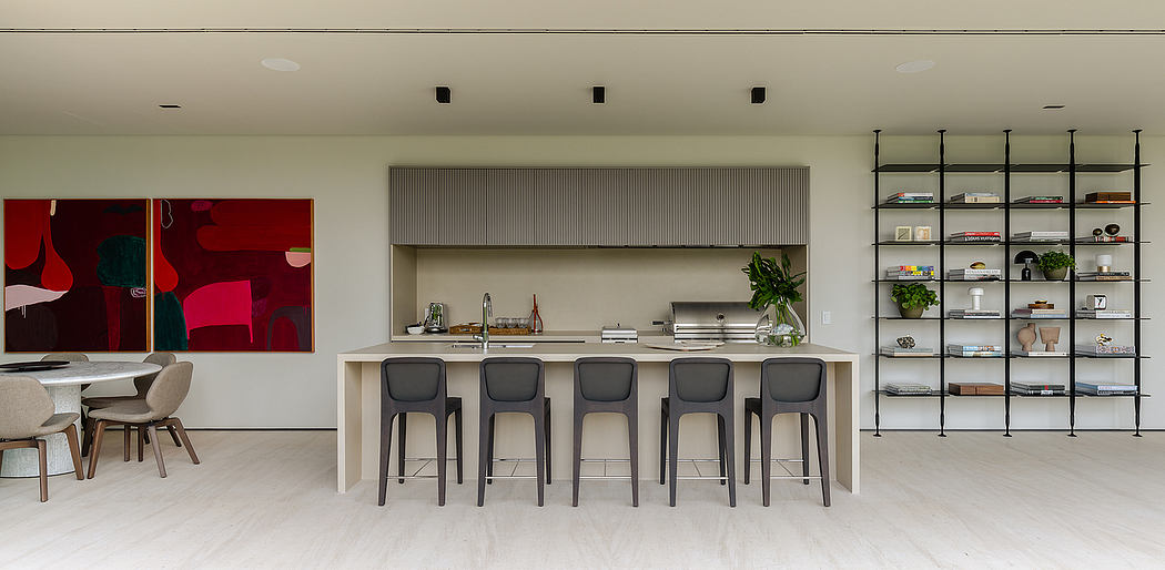 Sleek modern kitchen with minimalist white cabinets, black bar stools, and open shelving.