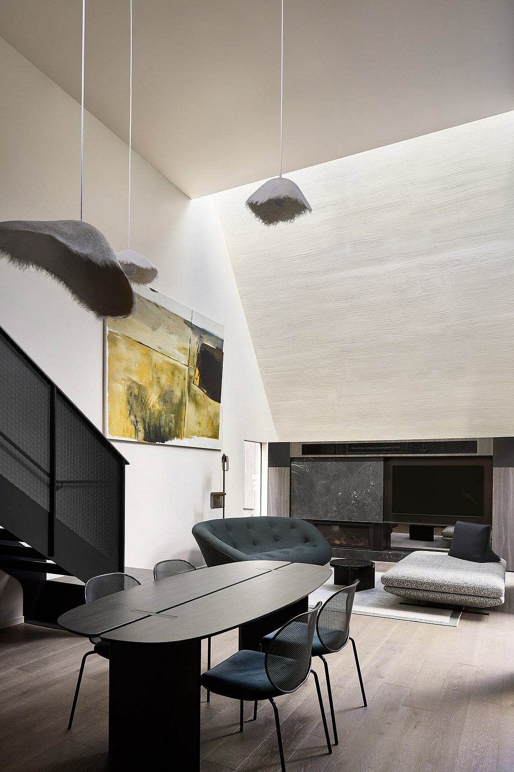 Sleek, modern interior with minimalist furniture, lighting fixtures, and abstract art.