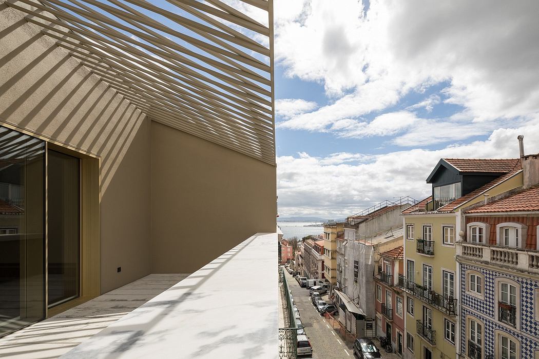 An urban architectural scene with a modern glass-and-steel canopy over a street lined with historic buildings.