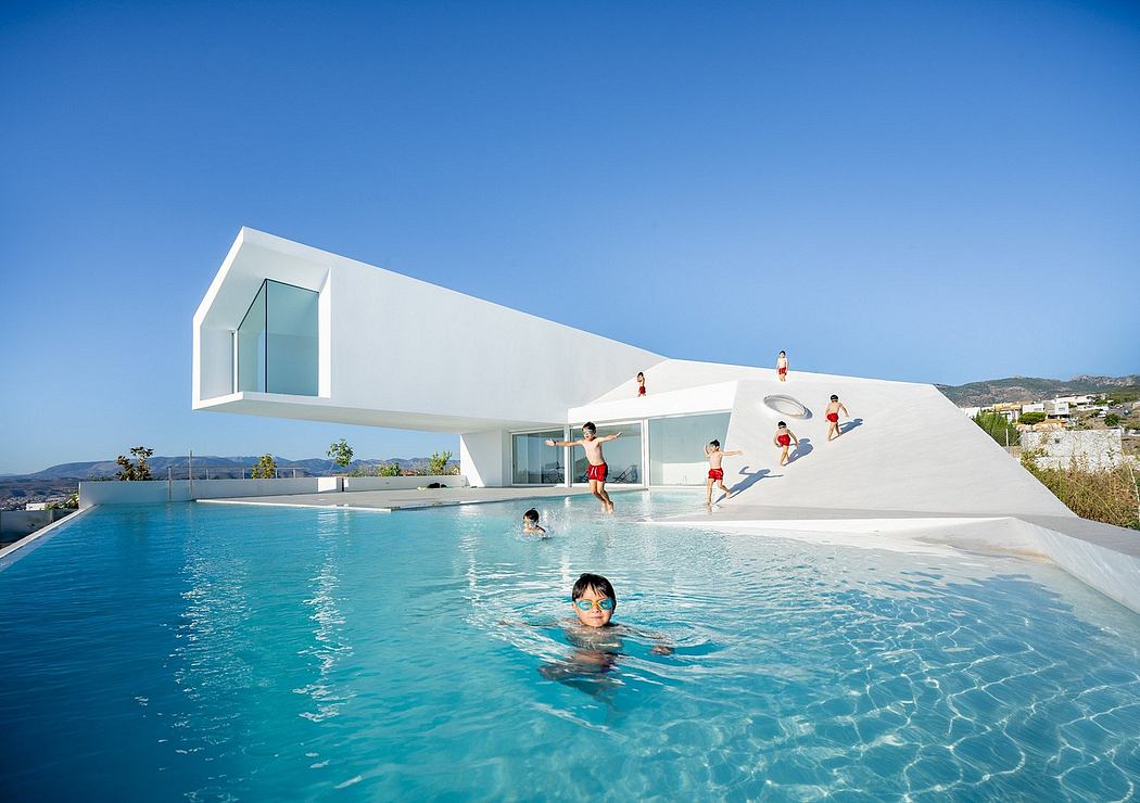 A modern, geometric structure with a large swimming pool and people enjoying the water.