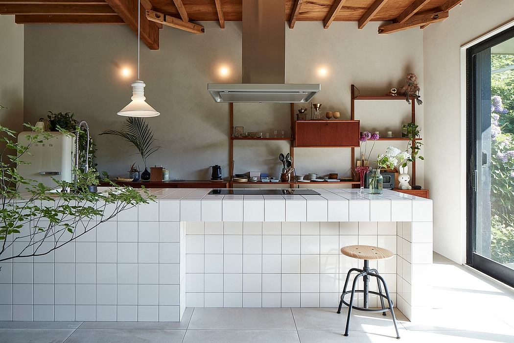 A cozy kitchen with wooden beams, tile flooring, and a modern, built-in cabinetry design.